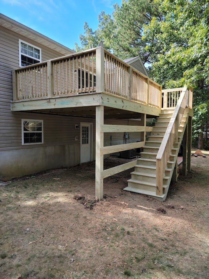Aubrey Court — elevated custom rear deck with pressure-treated lumber and stair access