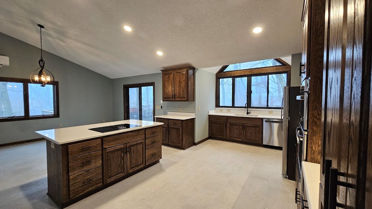 Butler kitchen remodel — custom oak cabinets, quartz island with cooktop