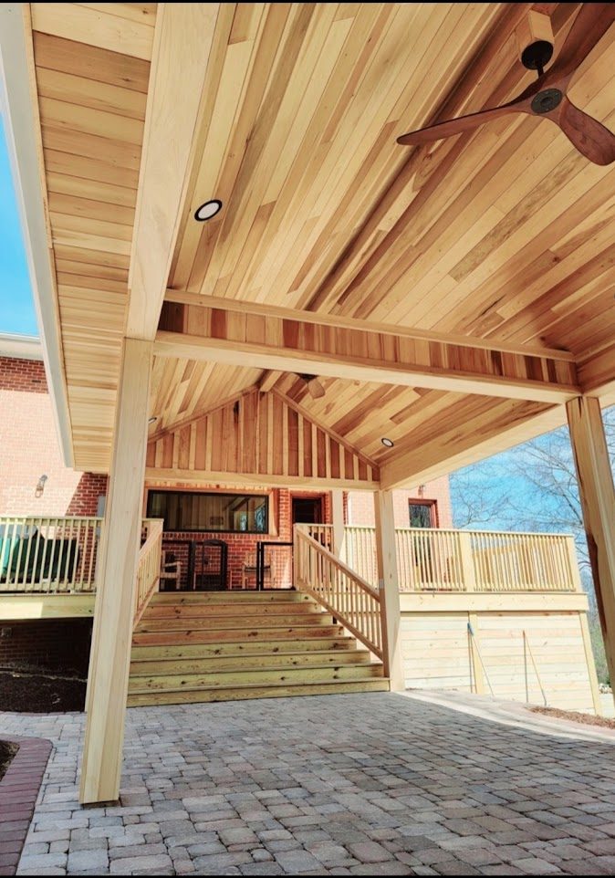 McKinley — covered paver patio with vaulted cedar tongue-and-groove ceiling and connected upper deck