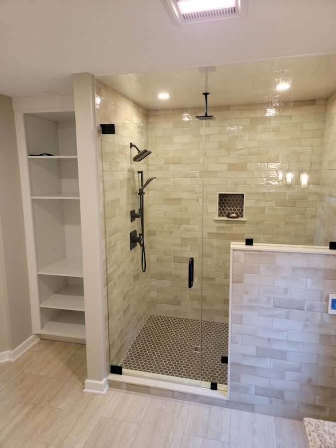 Saddle Ridge — custom walk-in shower with handmade subway tile, honeycomb niche, and frameless glass enclosure