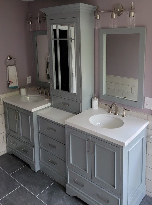 Village — custom his-and-hers gray double vanity with center linen tower